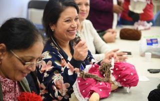 Women from around the world sew multicultural dolls for children with FACS Niagara